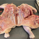 Cross-section of raw chicken on cutting board